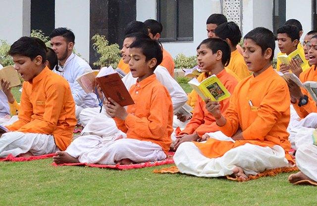 Students reading the Bhagavad Gita