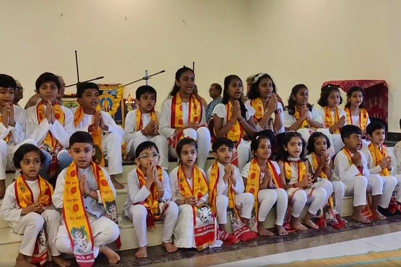 Children with folded hands at a Bal Vikas programme